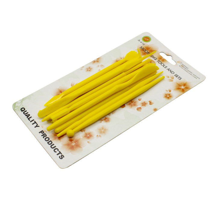 Yellow plastic fondant modelling tool on a white background