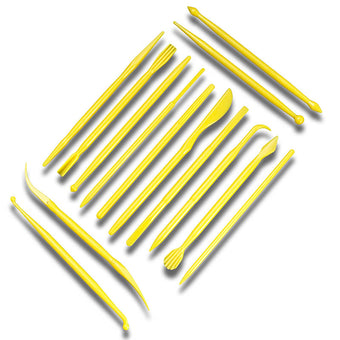 Set of yellow plastic fondant modelling tools on a white background