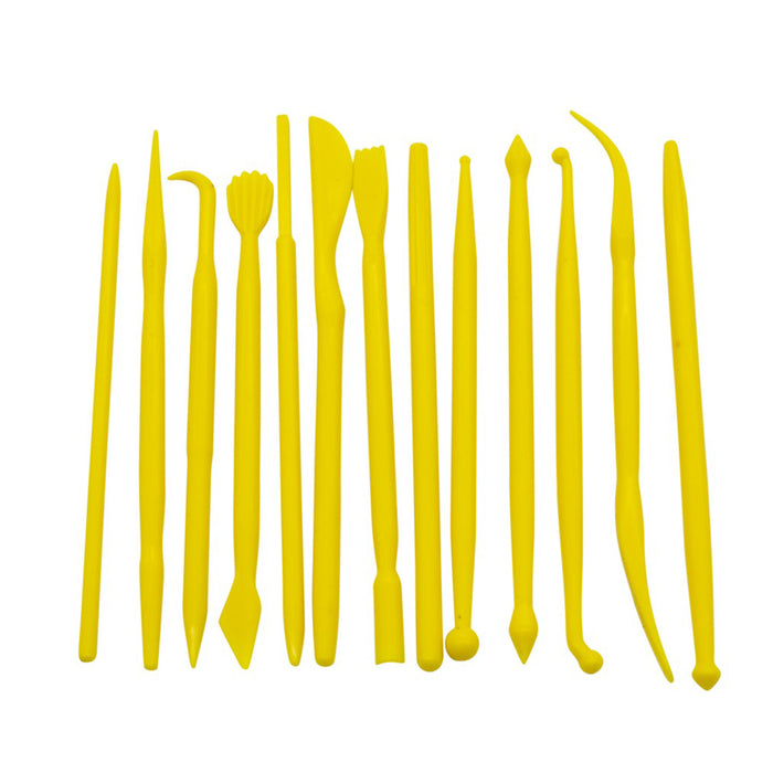 Yellow plastic fondant modelling tool on a white background